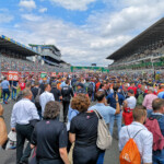 Thousands with exclusive grid walk wrist bands are allowed onto the grid just before the race start.